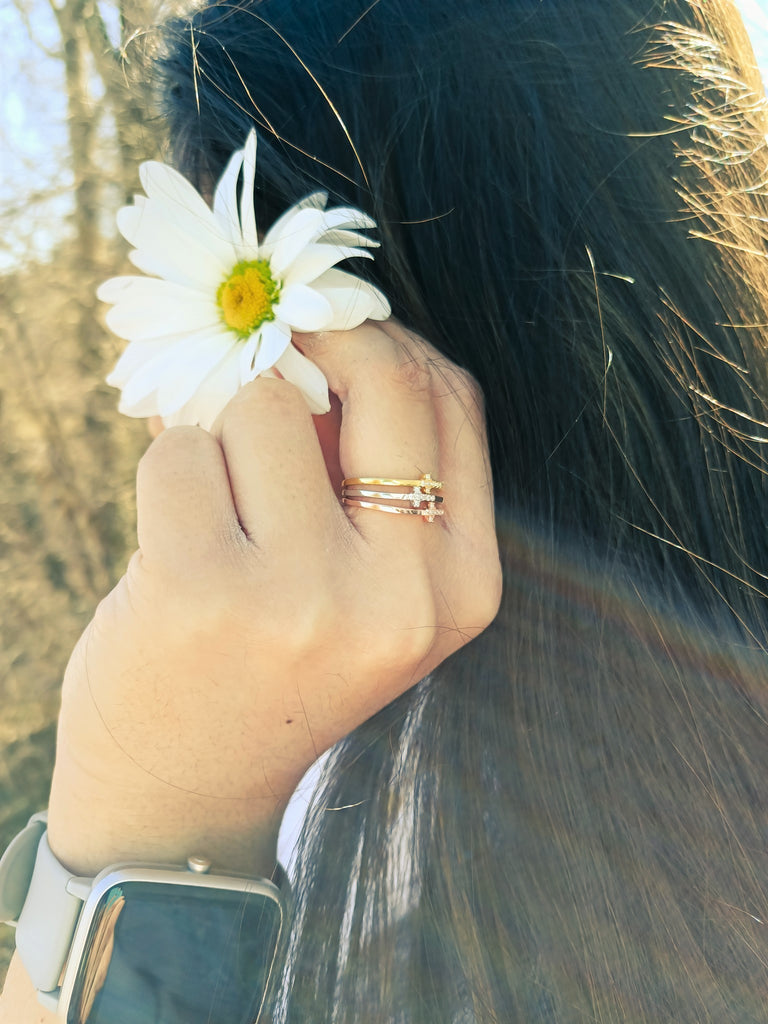 Sterling silver stackable rings with cubic zirconias.